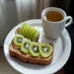 Peanut Butter Banana Toast with Kiwi and Tea First Image First Image